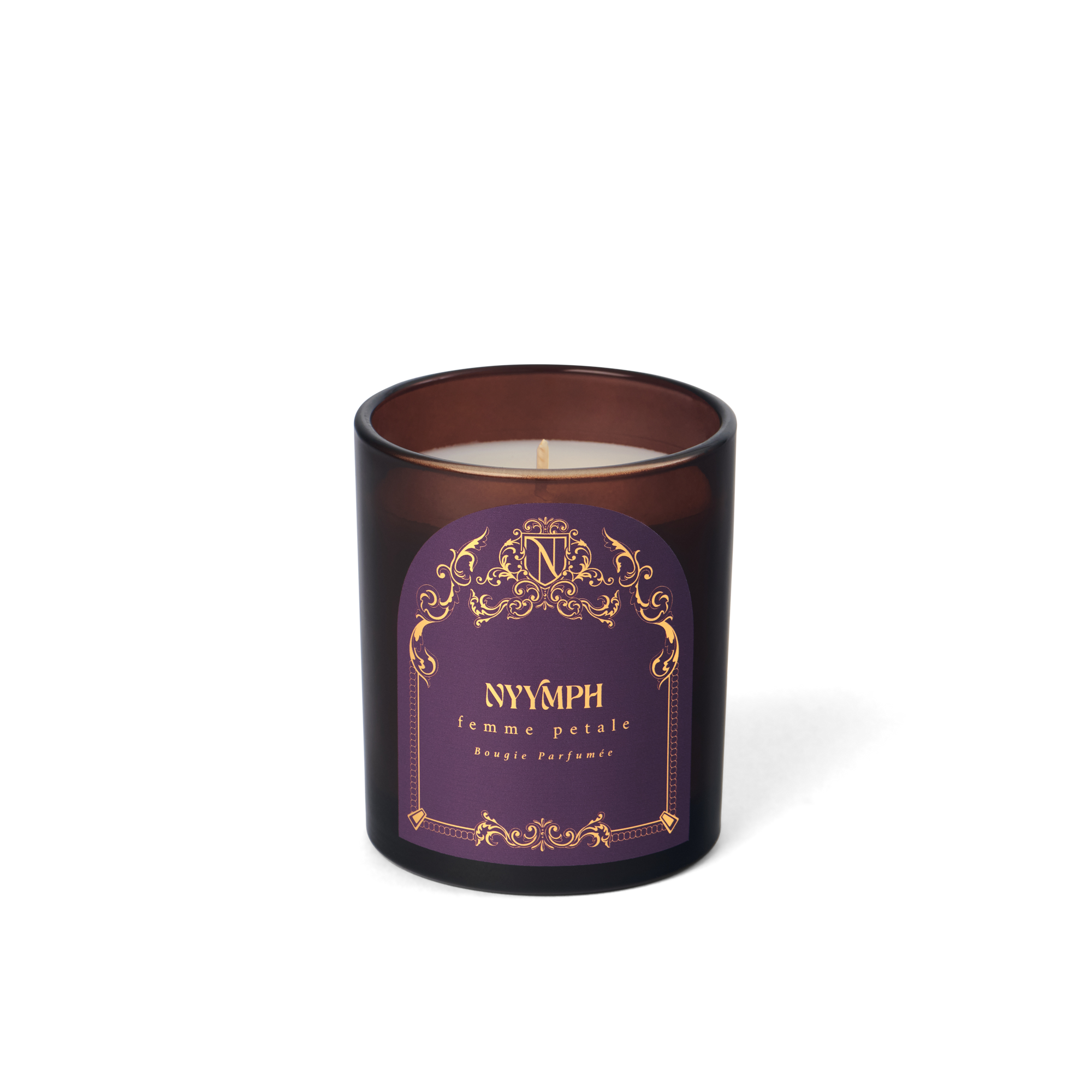 NYYMPH Femme Petale candle in purple and gold label with brown glass jar, isolated on transparent background.