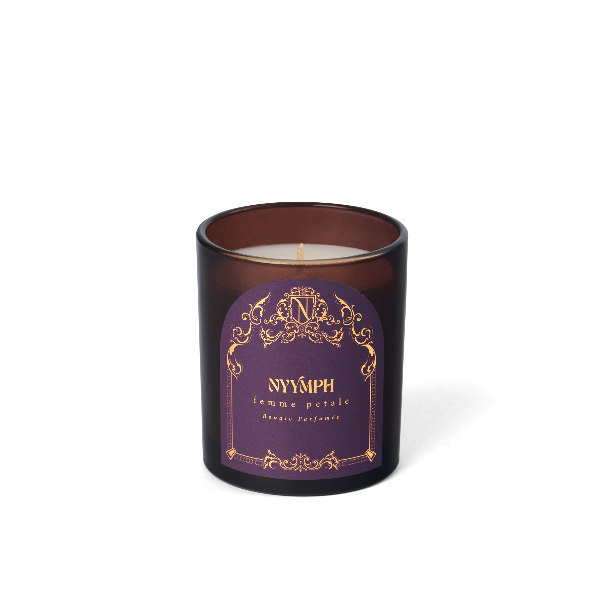 NYYMPH Femme Petale candle in purple and gold label with brown glass jar, isolated on transparent background.